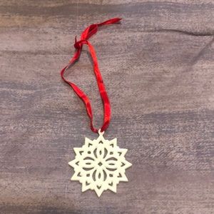 Lenox pierced snowflake Christmas charm ornament. Good condition. Red ribbon.